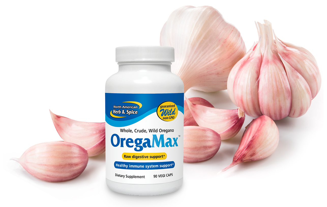 Raw garlic cloves with OregaMax product